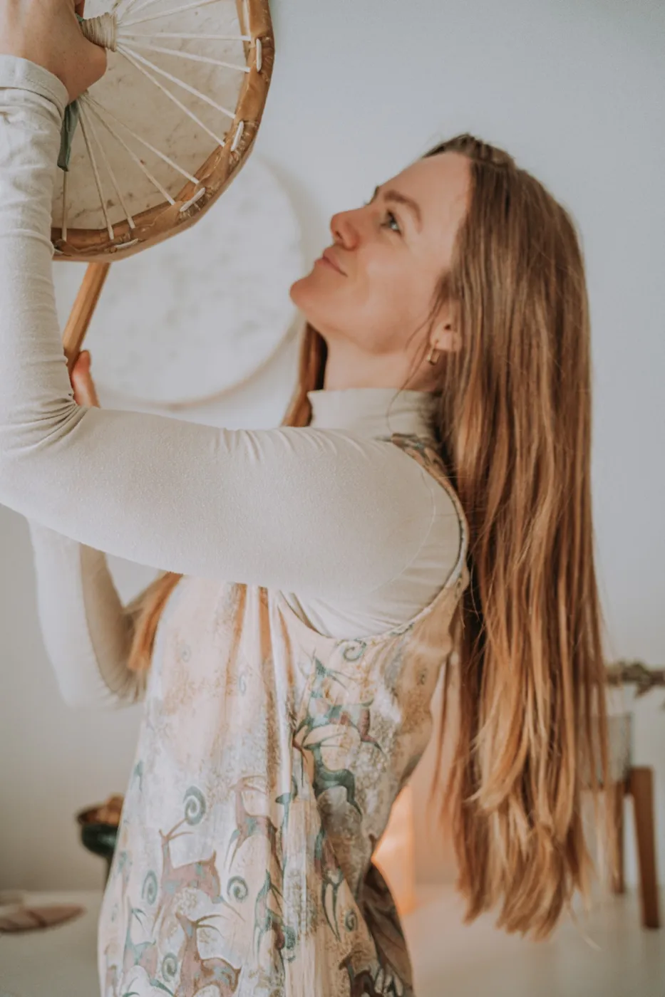 Cassandra holding a frame drum